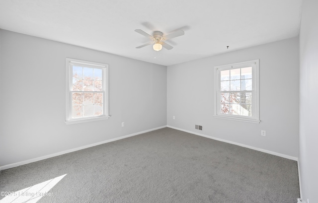 carpeted empty room with ceiling fan