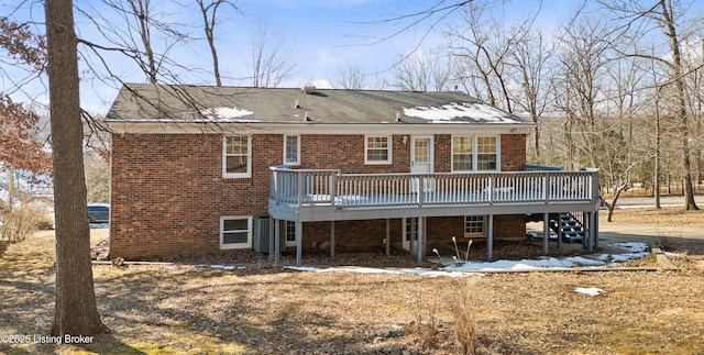 back of house with a wooden deck