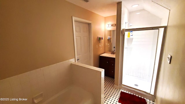 bathroom featuring vanity and separate shower and tub