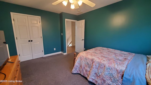 bedroom with ceiling fan, a closet, and dark colored carpet