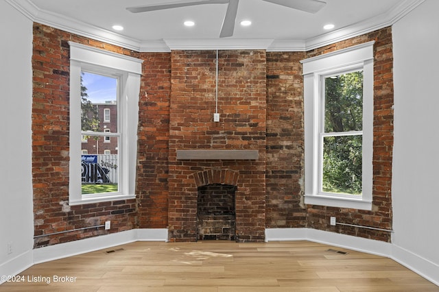 unfurnished living room with crown molding, light hardwood / wood-style flooring, and ceiling fan