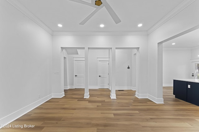 interior space featuring hardwood / wood-style floors, ornamental molding, and ceiling fan