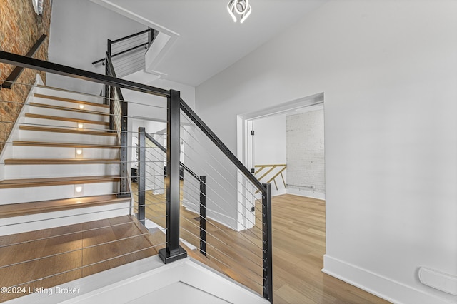 staircase featuring hardwood / wood-style floors