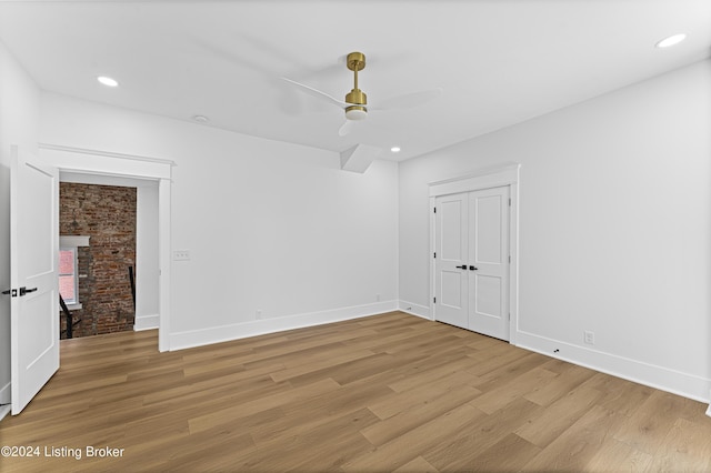 spare room featuring ceiling fan and light hardwood / wood-style floors