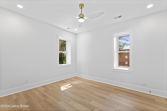 unfurnished room with light hardwood / wood-style flooring and ceiling fan