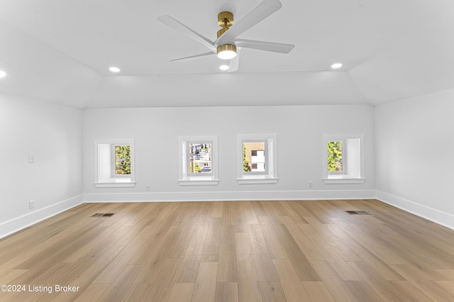 interior space featuring ceiling fan, lofted ceiling, and light wood-type flooring