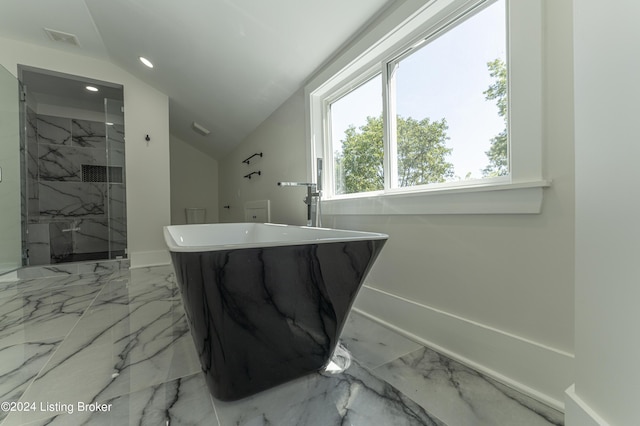 bathroom with lofted ceiling and separate shower and tub