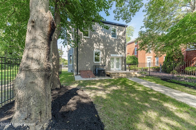 exterior space with central AC unit and french doors