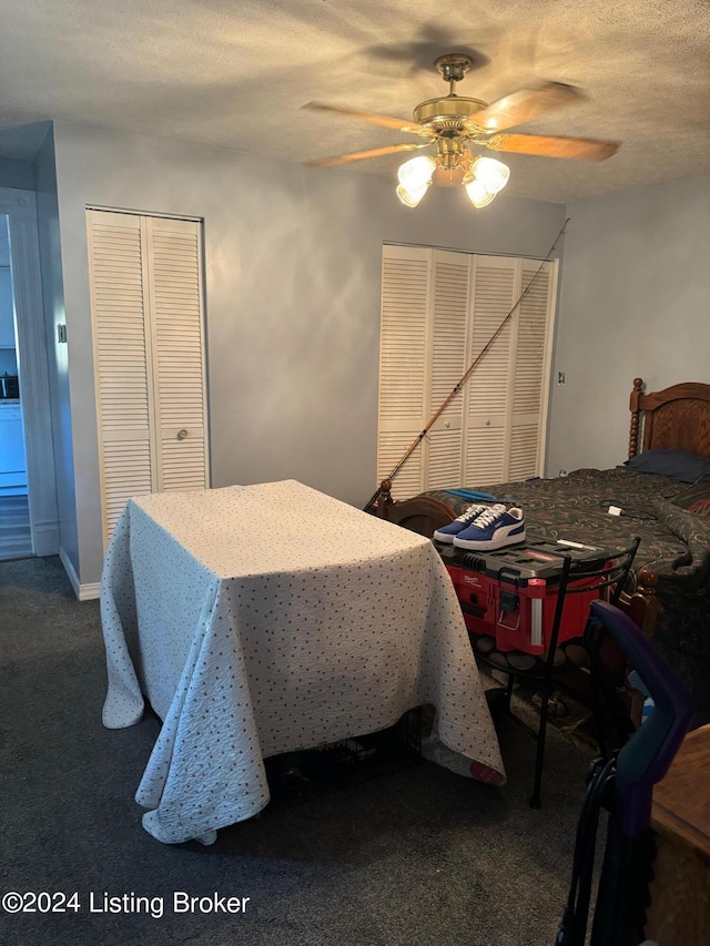 bedroom with carpet flooring, a textured ceiling, and ceiling fan