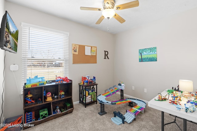 game room featuring ceiling fan and light carpet