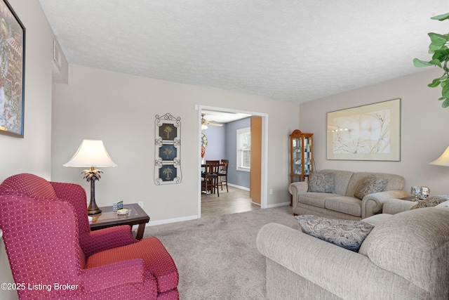 carpeted living room with a textured ceiling