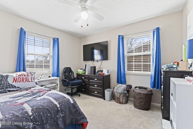 carpeted bedroom with ceiling fan