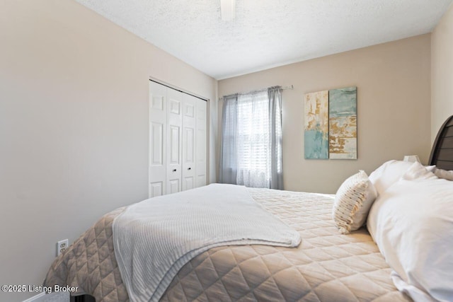 bedroom with a closet and a textured ceiling