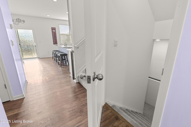 corridor featuring hardwood / wood-style floors