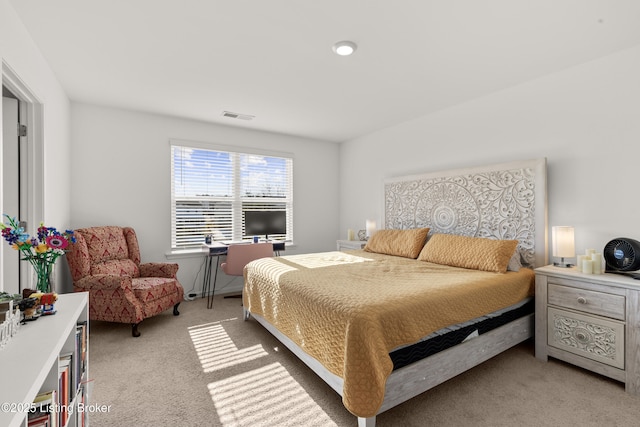 bedroom with light colored carpet