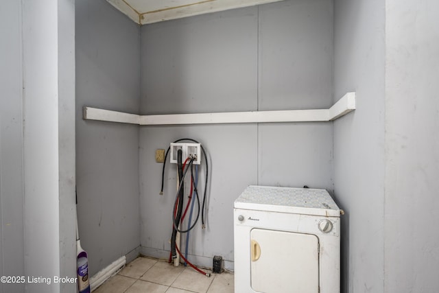 laundry room featuring light tile patterned flooring and washer / dryer