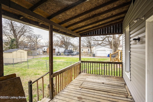 wooden terrace with a lawn