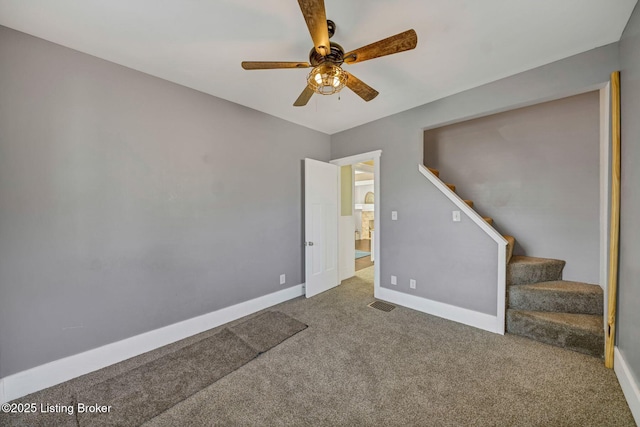 carpeted empty room with ceiling fan