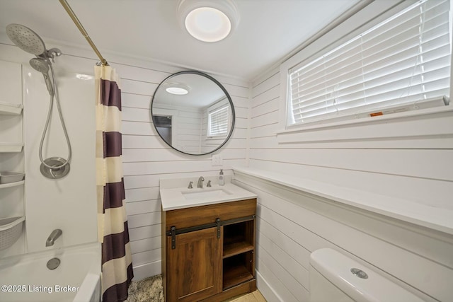 full bathroom with shower / tub combo, vanity, wooden walls, and toilet