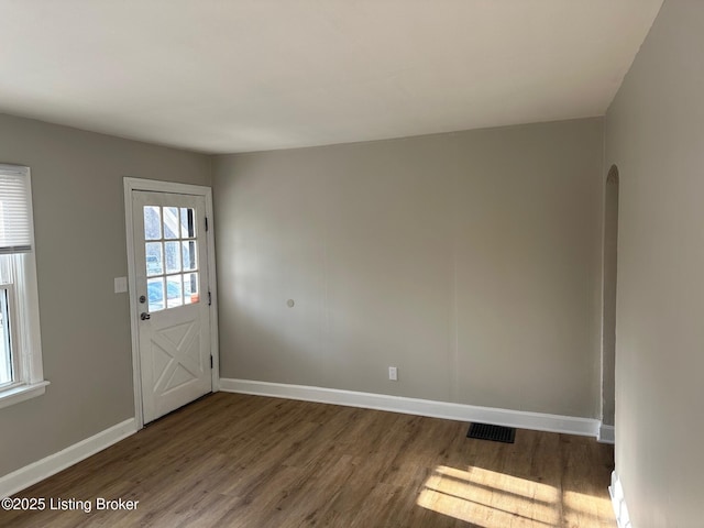 doorway to outside featuring dark hardwood / wood-style flooring