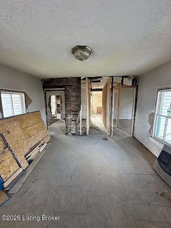 interior space with a textured ceiling