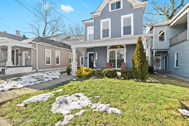 view of front facade featuring a porch and a front lawn