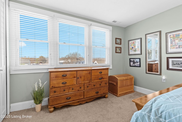 bedroom featuring light colored carpet