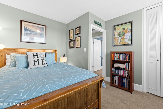 bedroom featuring light carpet and a closet