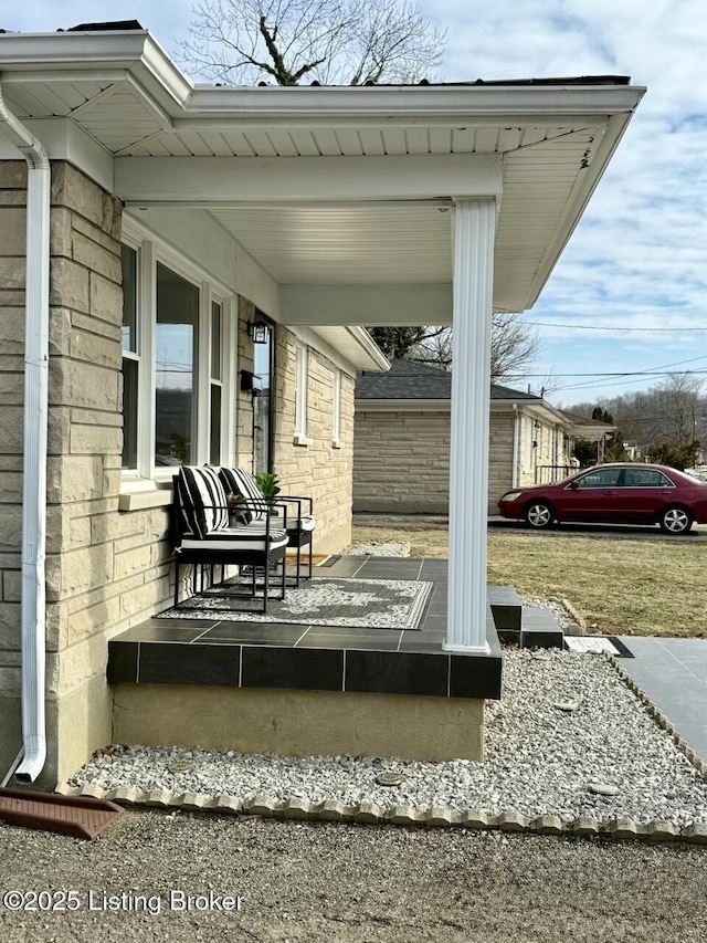 wooden terrace featuring covered porch