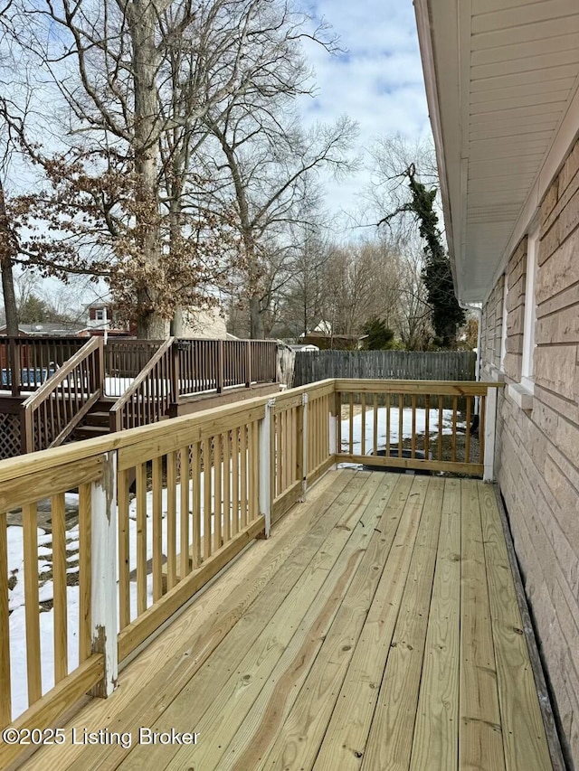 view of snow covered deck