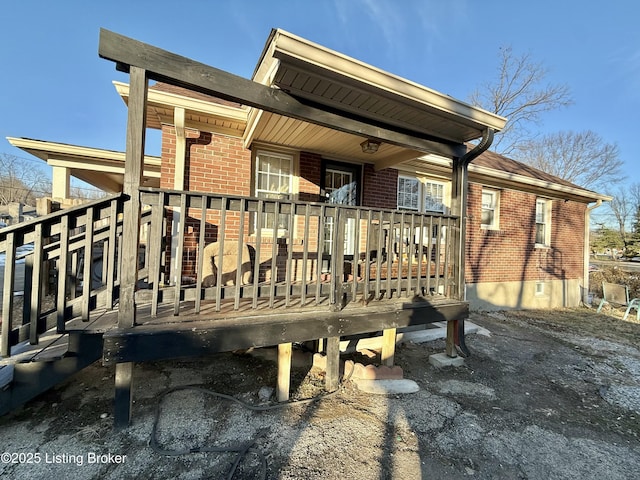 back of house featuring a deck