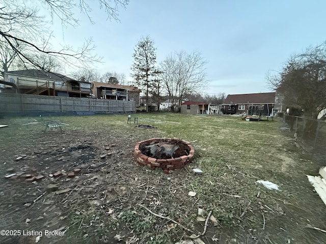 view of yard featuring a fire pit