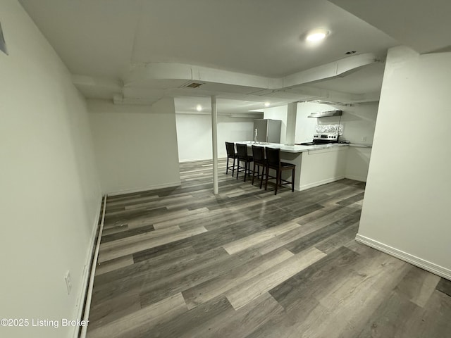 unfurnished dining area featuring dark hardwood / wood-style flooring