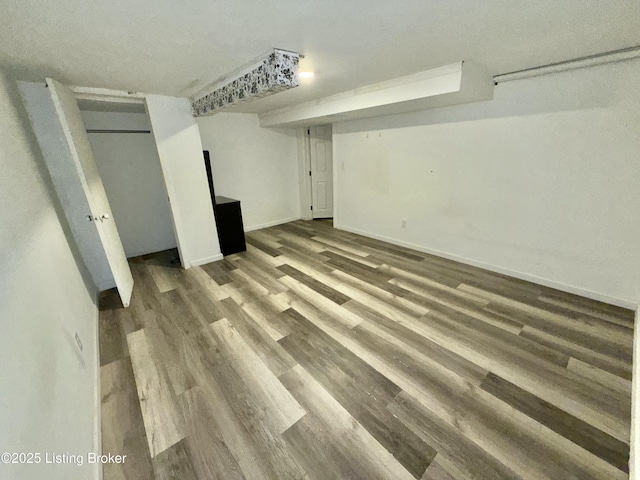 basement featuring hardwood / wood-style floors