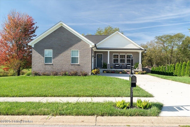 view of front of home with a front lawn and a porch