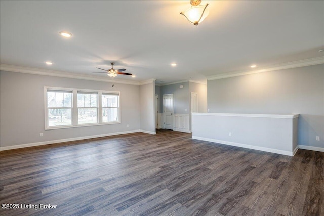 empty room with dark hardwood / wood-style flooring, ornamental molding, and ceiling fan