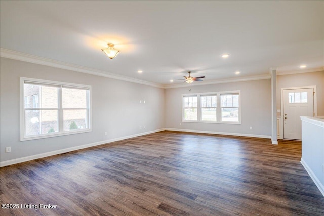 spare room with ornamental molding, dark wood-type flooring, and ceiling fan