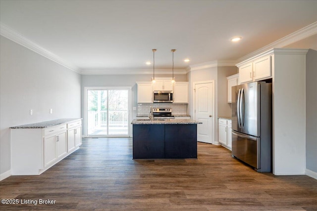 kitchen featuring light stone countertops, white cabinetry, appliances with stainless steel finishes, and pendant lighting