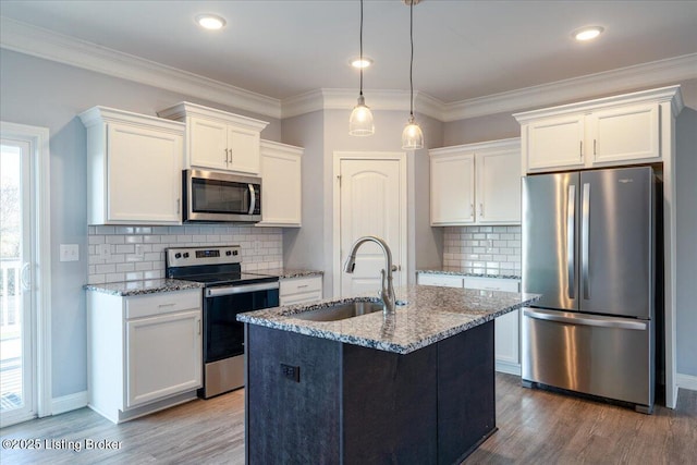 kitchen with appliances with stainless steel finishes, sink, and white cabinets