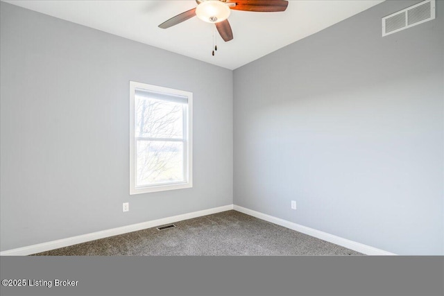 carpeted empty room featuring ceiling fan