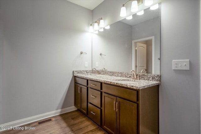 bathroom featuring vanity and hardwood / wood-style floors