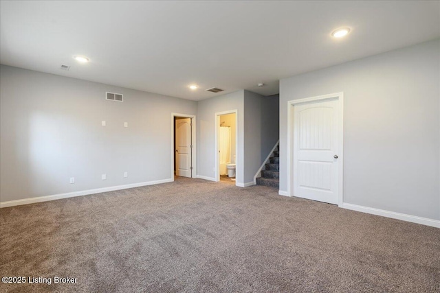 unfurnished room with carpet floors