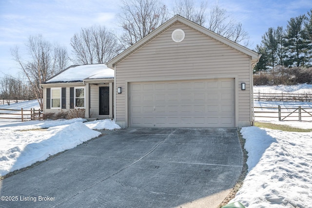 ranch-style house featuring a garage