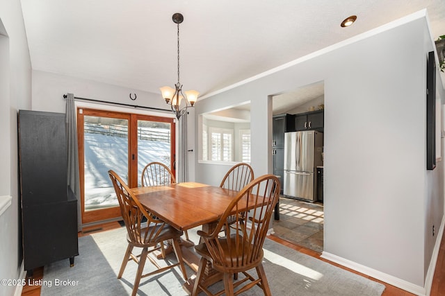 dining space featuring a notable chandelier