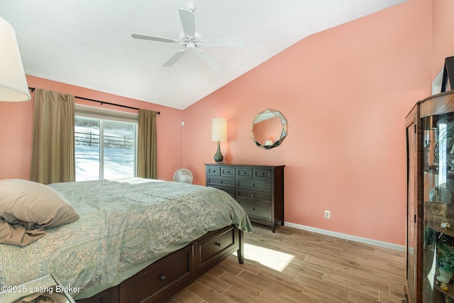 bedroom with ceiling fan and lofted ceiling