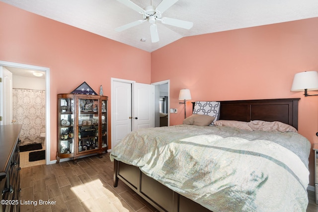 bedroom with lofted ceiling, hardwood / wood-style floors, and ceiling fan