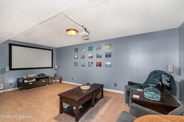 carpeted home theater room with a textured ceiling