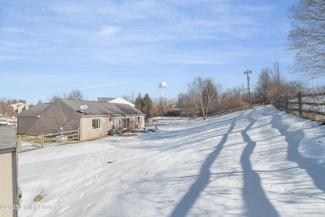 view of yard layered in snow