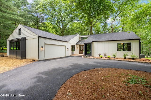 modern farmhouse with a garage