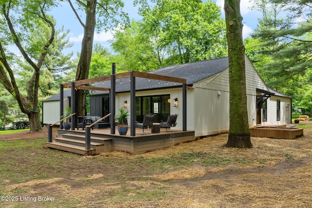 rear view of house with a deck